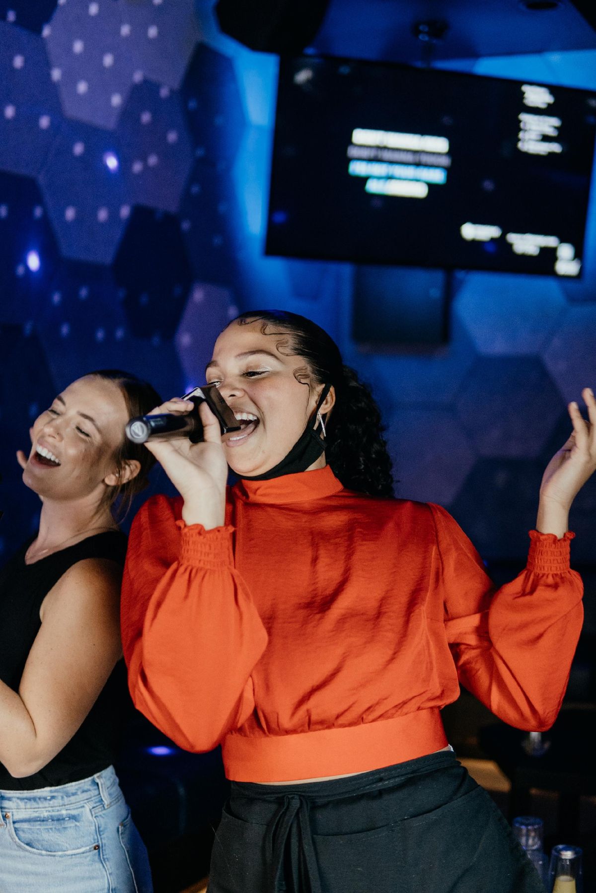 Colleagues singing together on a work night out